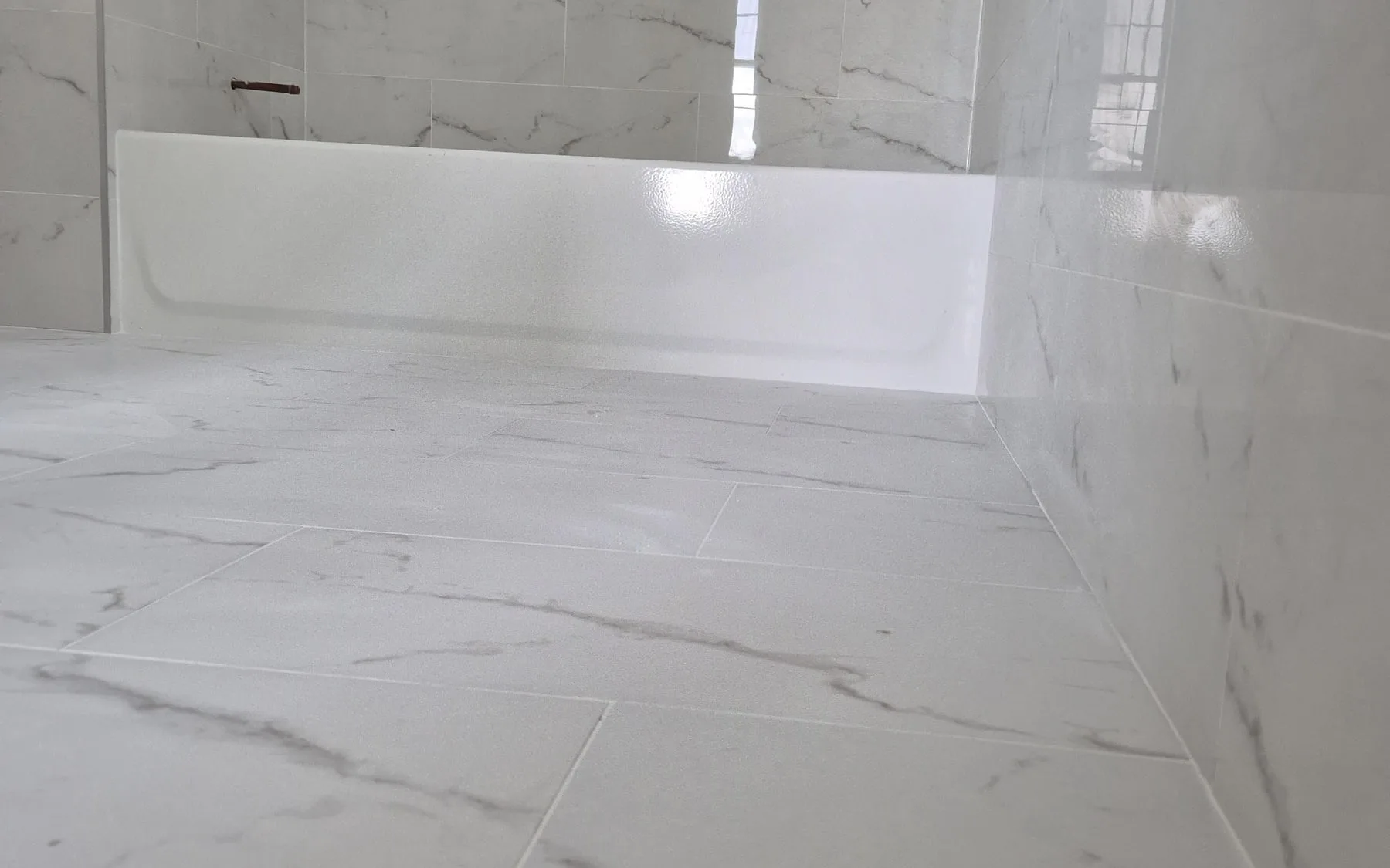 Pre-war Upper West Side bathroom with natural stone walls — reference for on-site templating and fitting work